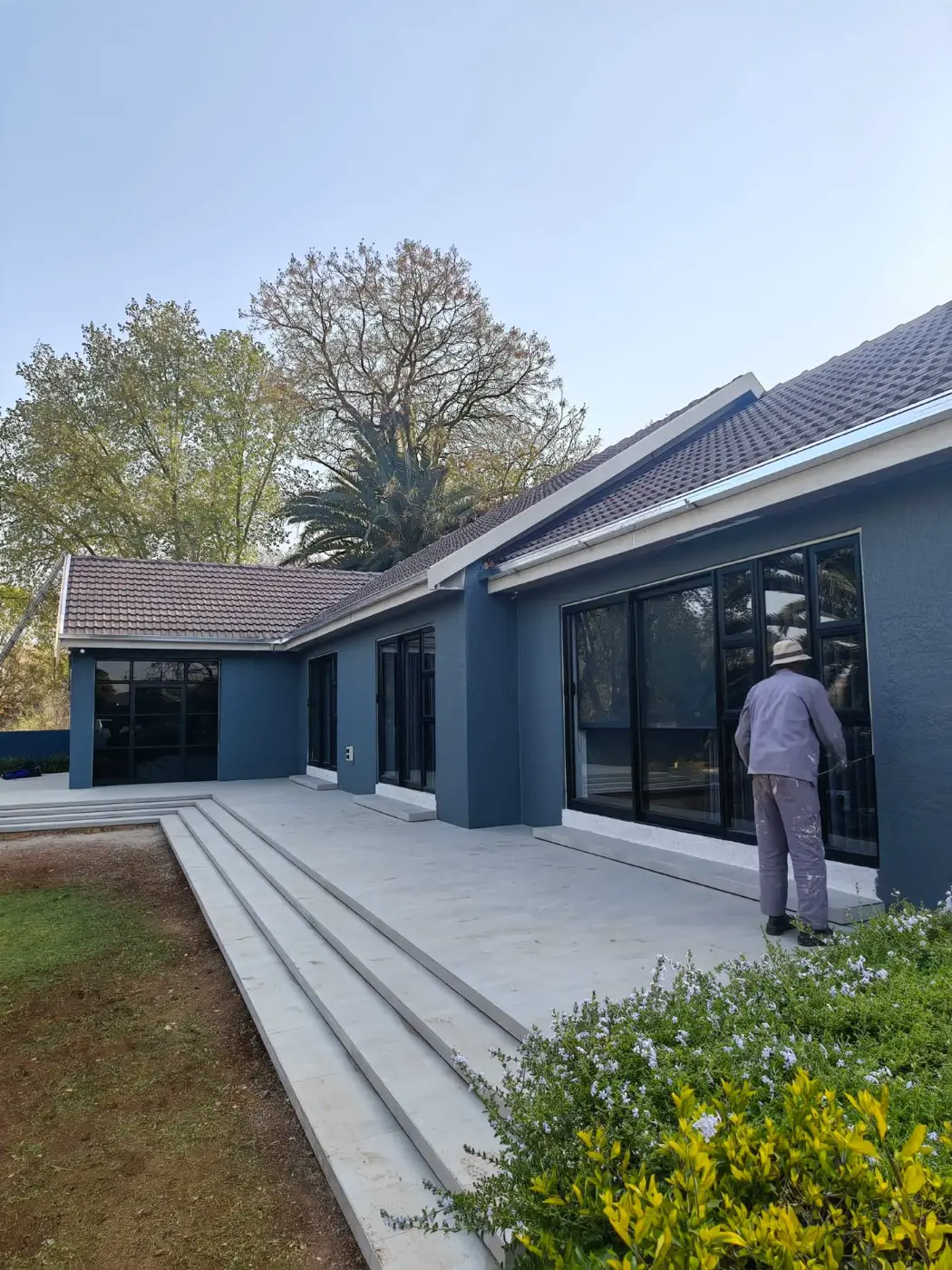The new patio and steps running the length of the house